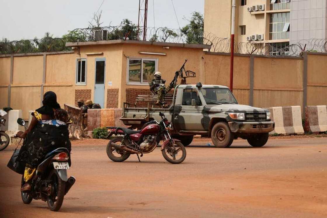 Soldiers patrol the streets of Ouagadougou after shots rang out during the morning Soldiers patrol the streets of Ouagadougou after shots rang out during the morning
