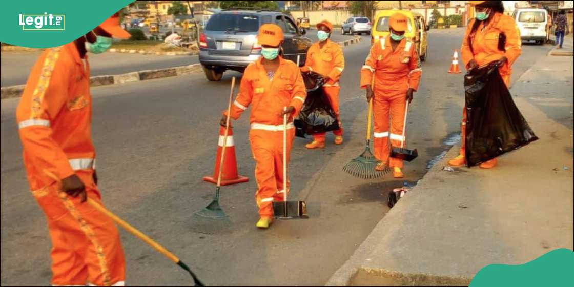 LAWMA street sweepers at work along a major road in Lagos. LAWMA street sweepers at work along a major road in Lagos.