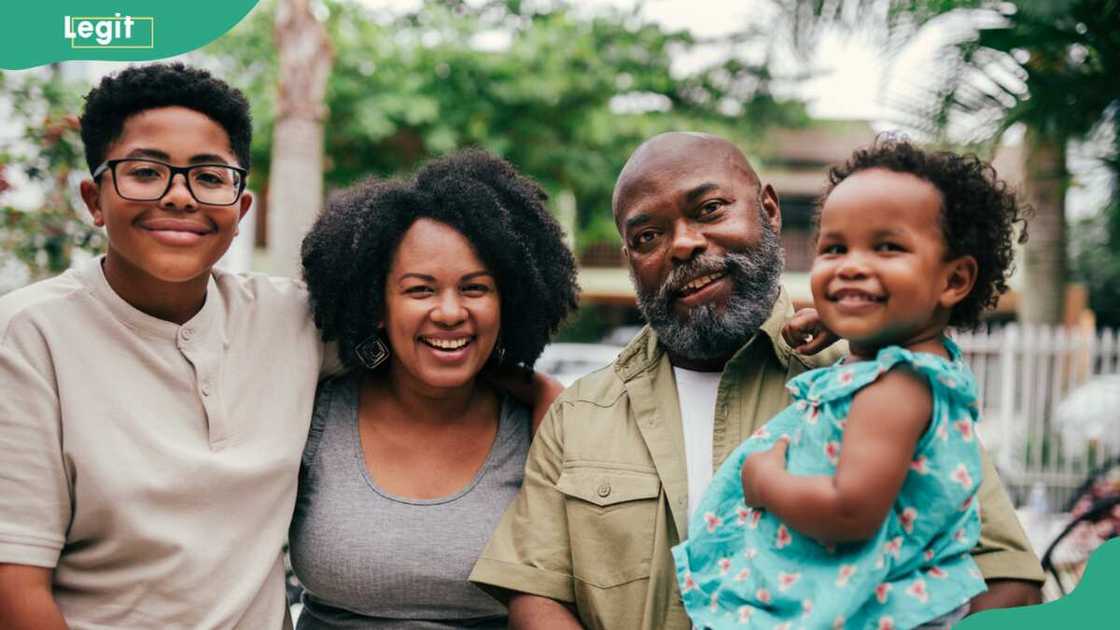 Photo showing 4 people from different generations Photo showing 4 people from different generations