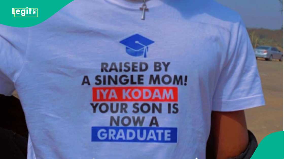 Man inscribes "raised by a single mom! Iya Kodam your son is now a graduate" on his shirt to honour his mother as he graduates from university.