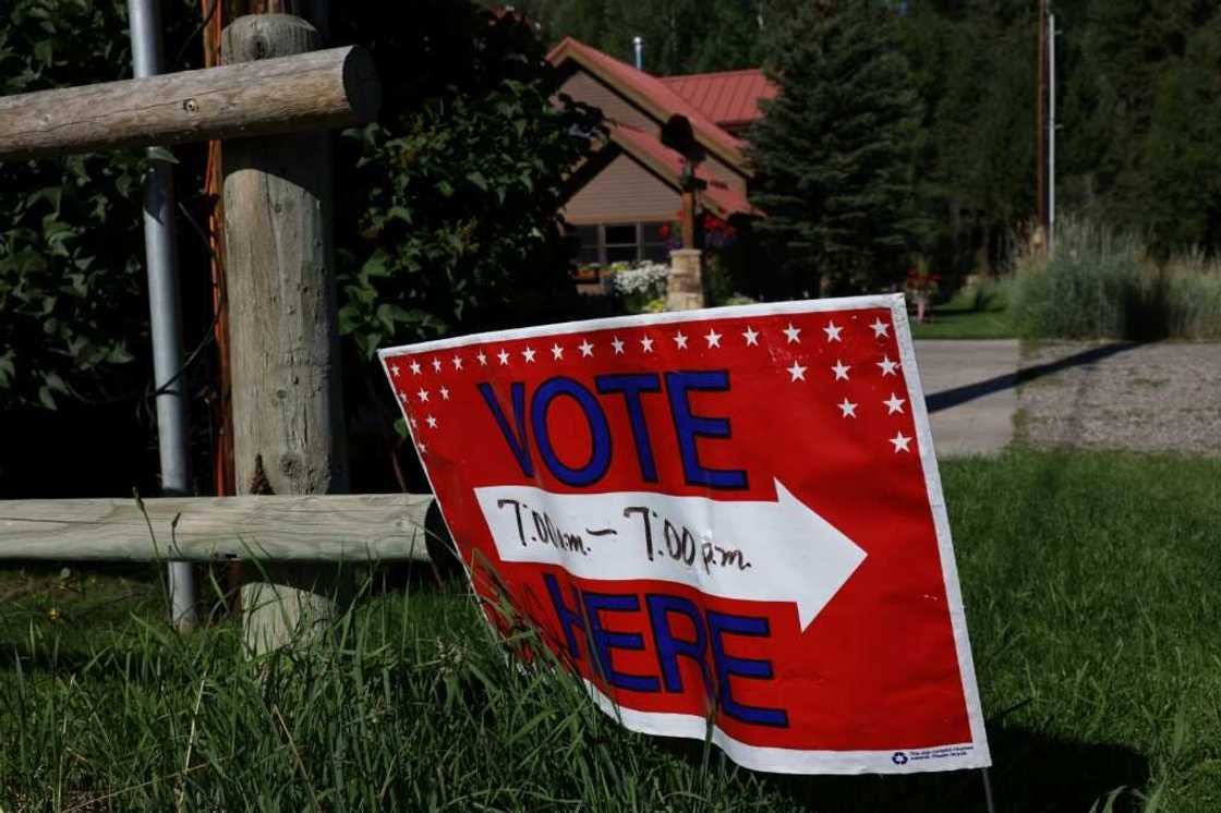A sign directs voters to a polling place at the Old Wilson Schoolhouse August 16, 2022 in Wilson, Wyoming ahead of primary elections leading up to the Novermber 8 midterm elections A sign directs voters to a polling place at the Old Wilson Schoolhouse August 16, 2022 in Wilson, Wyoming ahead of primary elections leading up to the Novermber 8 midterm elections