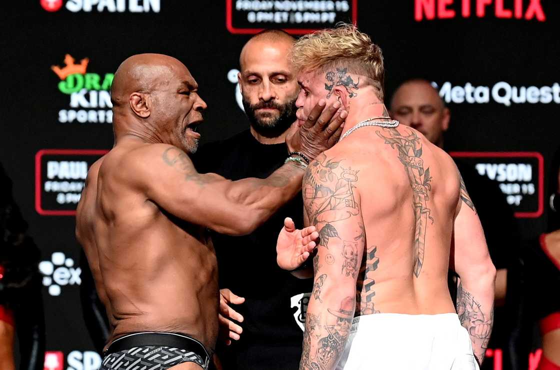 Mike Tyson delivers a shocking slap to Jake Paul during their intense face-off before the highly anticipated fight. Mike Tyson delivers a shocking slap to Jake Paul during their intense face-off before the highly anticipated fight.