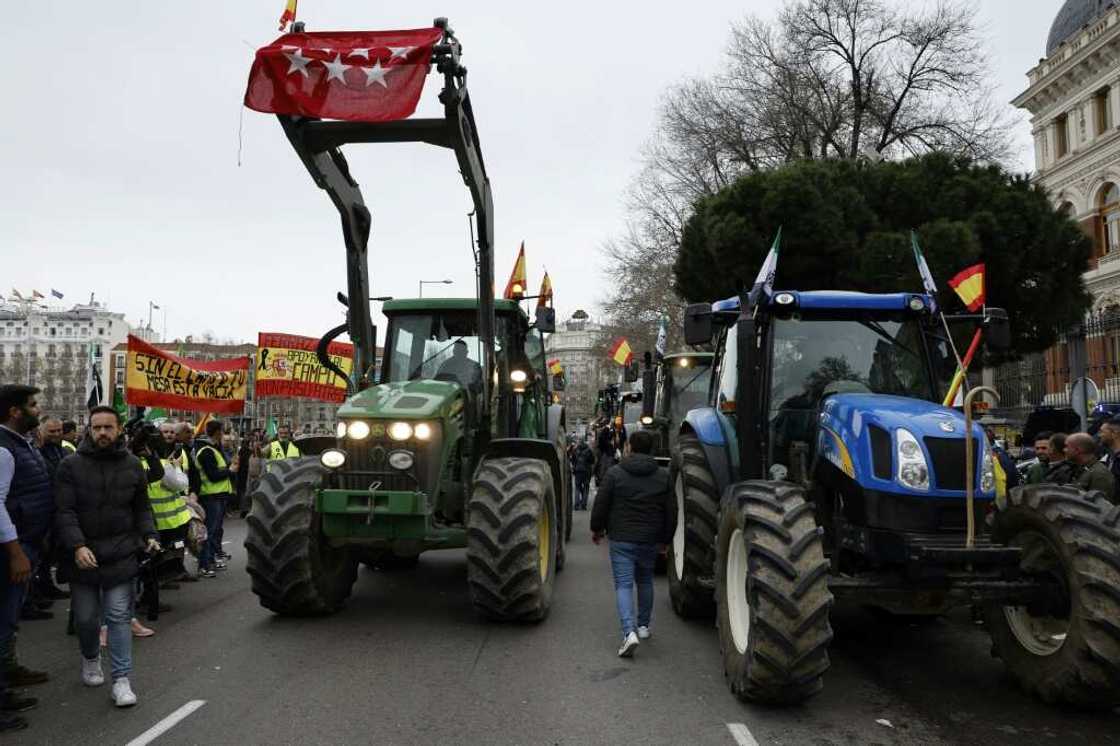 Tractors block off a street in front of Spain's agriculture ministry in central Madrid during a farmers protest on their conditions and European agricultural policy Tractors block off a street in front of Spain's agriculture ministry in central Madrid during a farmers protest on their conditions and European agricultural policy