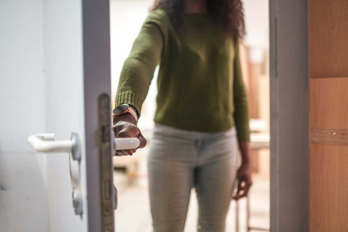 A woman opening the door