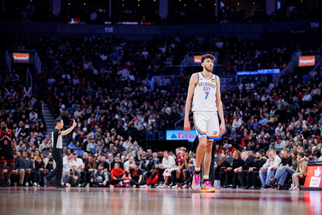 Chet Walker walks the floor during a break in play against the Toronto Raptors