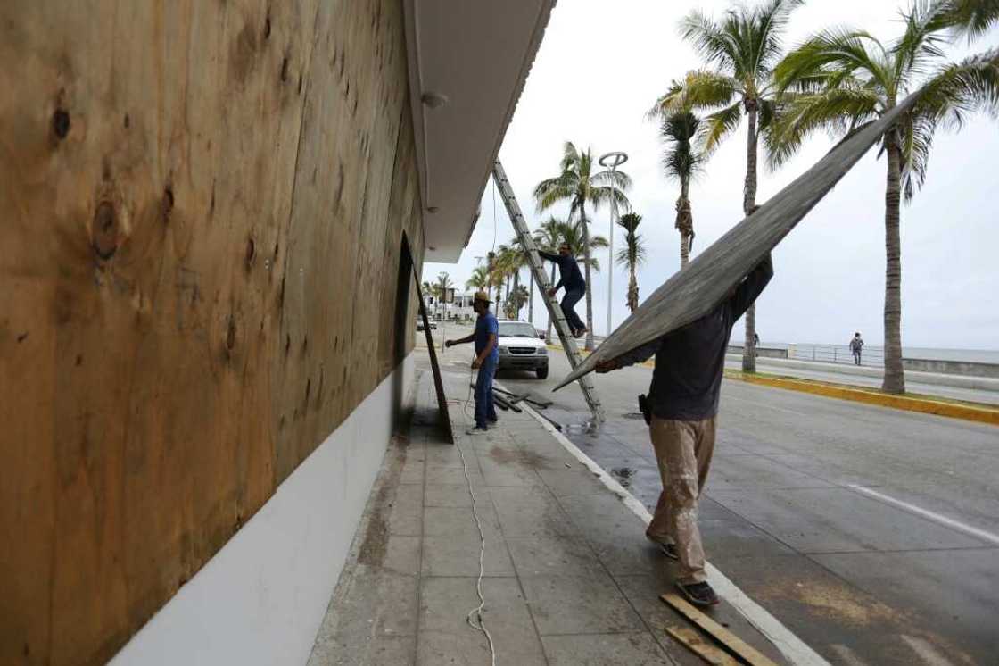 Workers board up windows ahead of Hurricane Orlene's arrival, in Mazatlan, Mexico on October 2, 2022 Workers board up windows ahead of Hurricane Orlene's arrival, in Mazatlan, Mexico on October 2, 2022