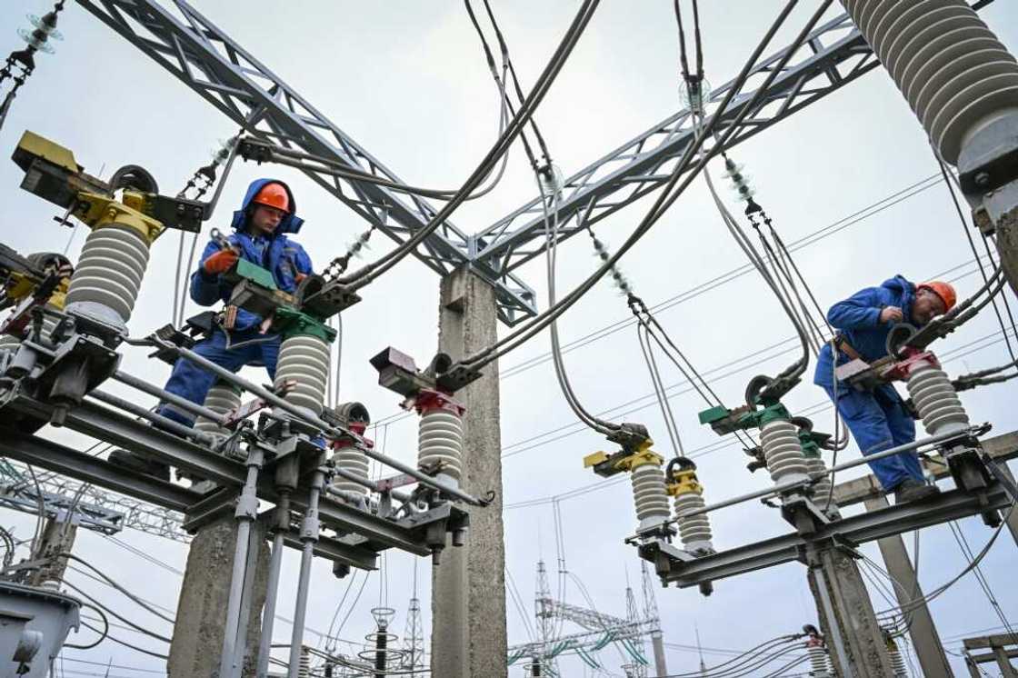 Keeping the lights on: electricians work on power lines near Balti, Moldova Keeping the lights on: electricians work on power lines near Balti, Moldova