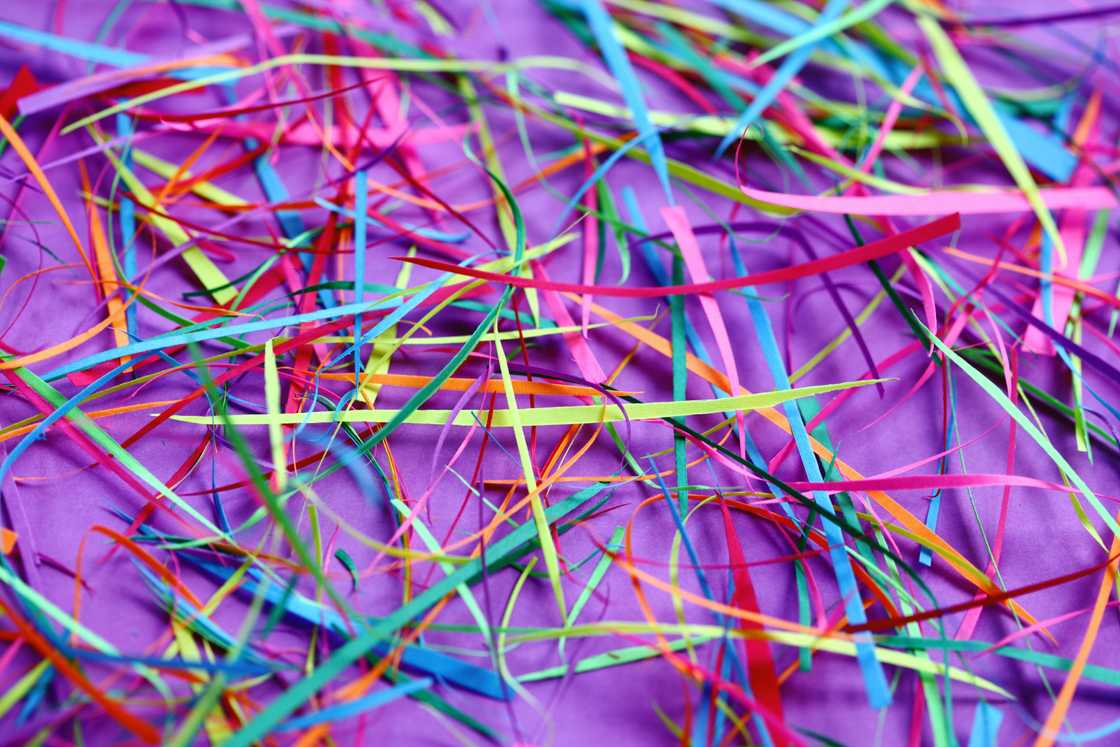 Colourful shredded paper on a purple background