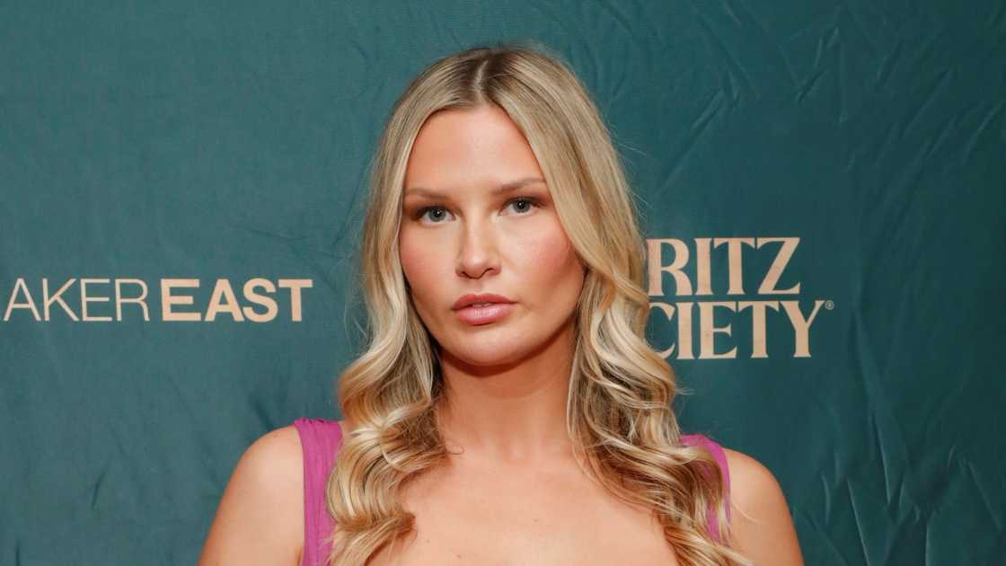 Molly O'Connell poses standing in a pink outfit. Molly O'Connell poses standing in a pink outfit.