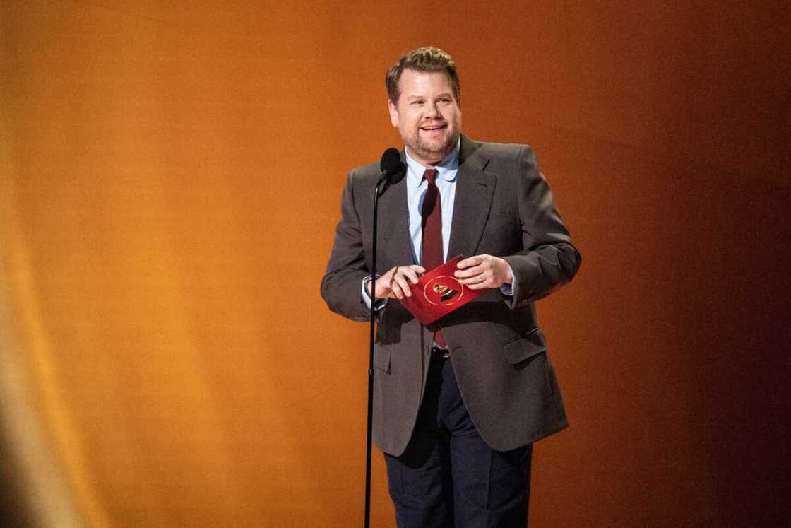 James Corden speaks during the 65th GRAMMY Awards ceremony. James Corden speaks during the 65th GRAMMY Awards ceremony.