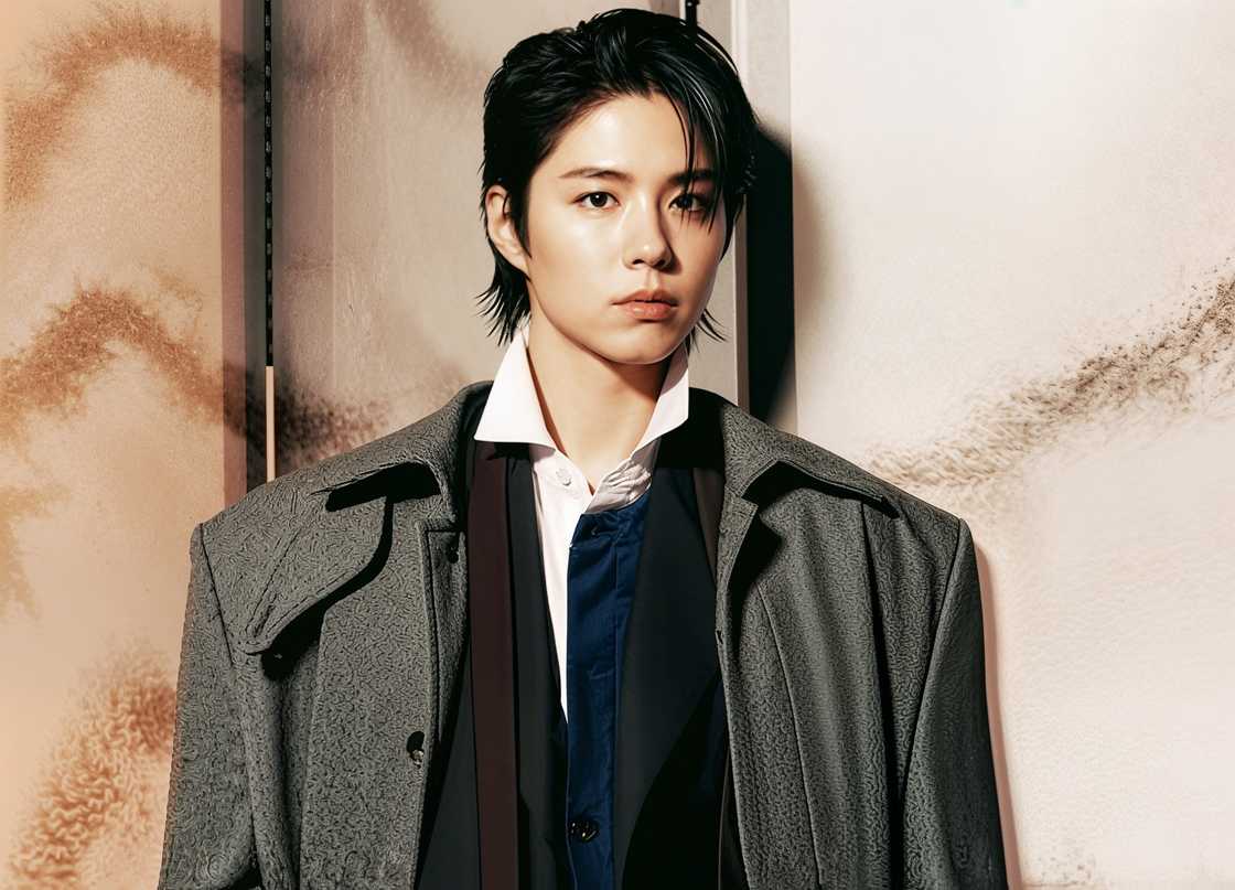 Park Bo-gum poses standing in a multi-layered outfit