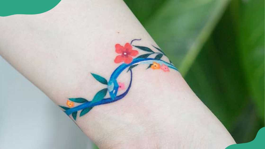 Floral snake wrist tattoos. Floral snake wrist tattoos.