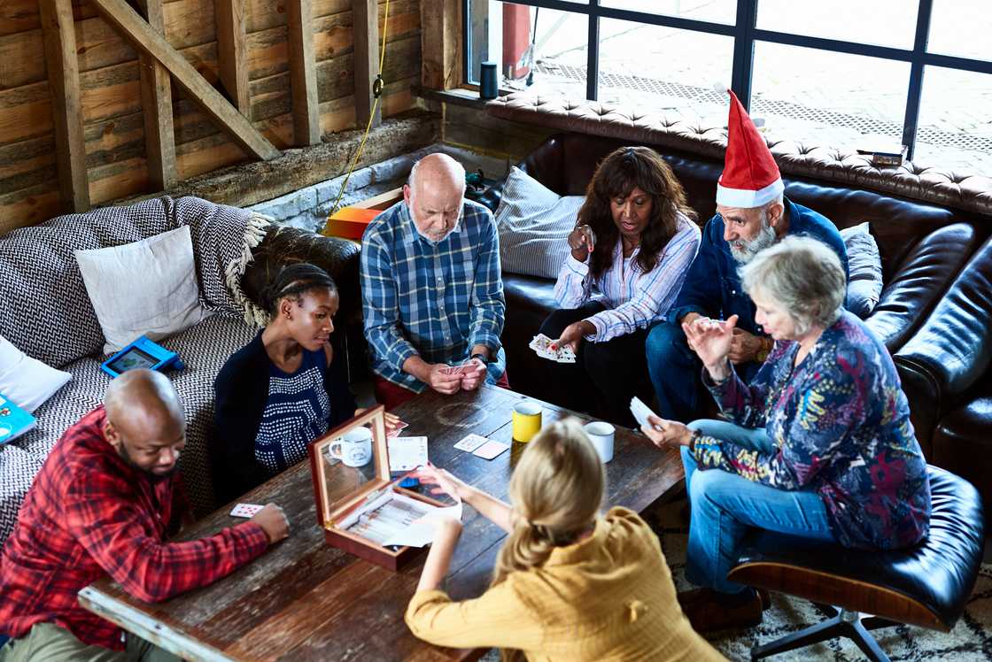 Family playing games on coffee table