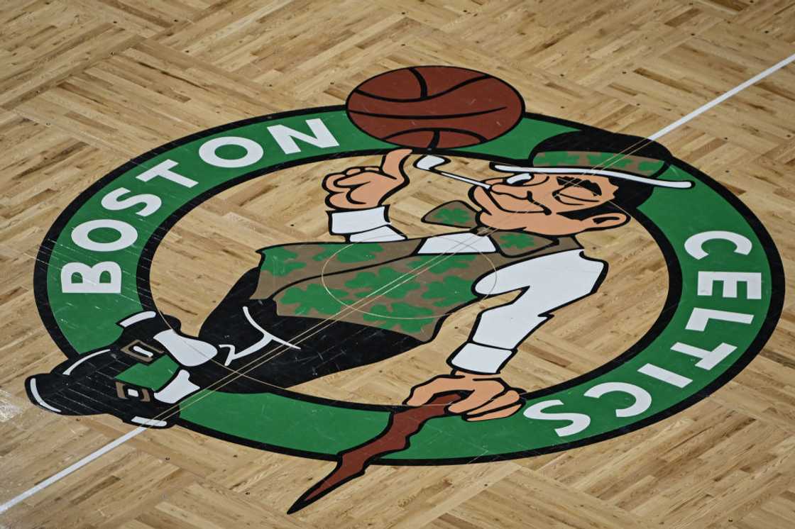 Boston Celtics logo on a basketball court