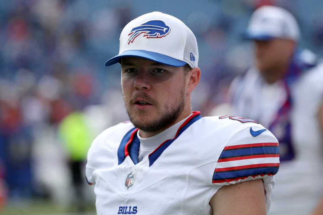 Tyler Bass walks off the field after a preseason game against the Carolina Panthers