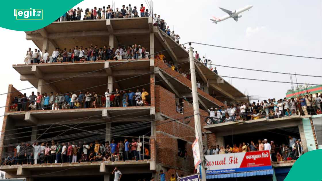 Crowd gather at scene of plane crash in Bangladesh. Crowd gather at scene of plane crash in Bangladesh.