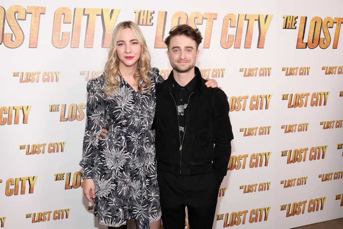 Erin Darke (L) and Daniel Radcliffe pose for a photo at an award ceremony red carpet