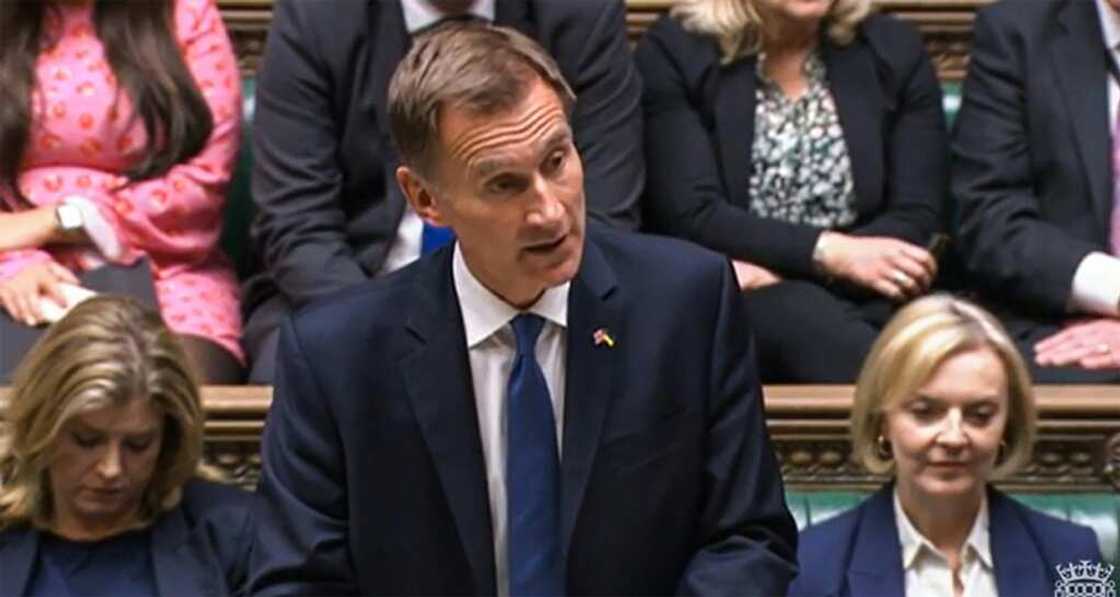 New finance minister Hunt told parliament Truss had agreed to reverse almost all the tax measures announced three weeks ago as the grim faced premier looked on New finance minister Hunt told parliament Truss had agreed to reverse almost all the tax measures announced three weeks ago as the grim faced premier looked on