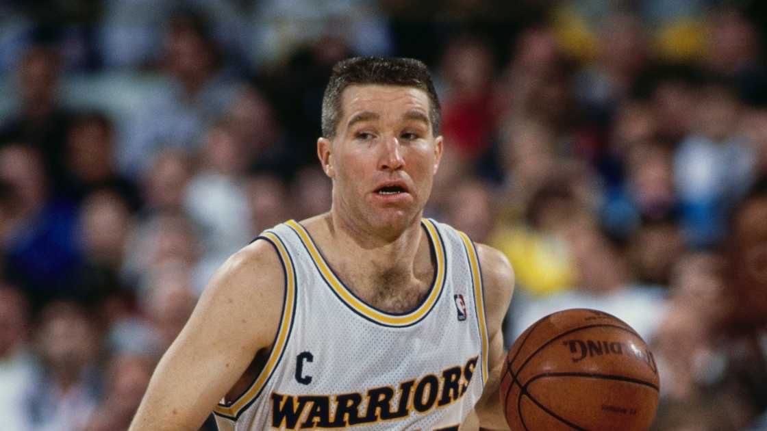 Chris Mullin of the Golden State Warriors dribbles the ball during a game