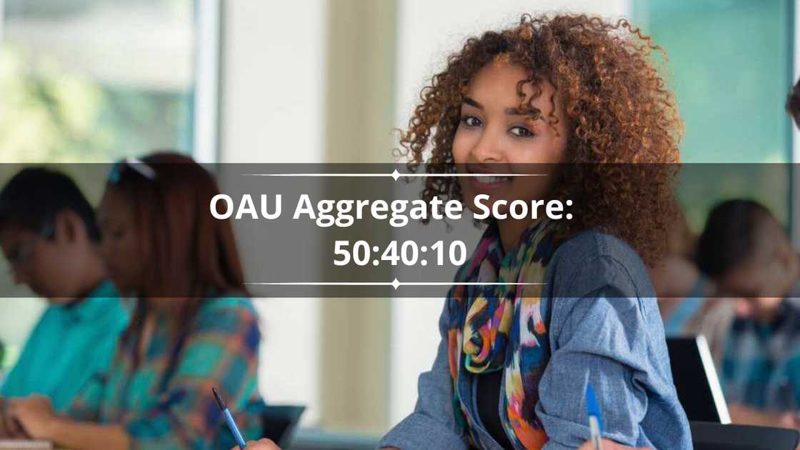 A student is sitting in a college classroom taking an exam with her classmates. A student is sitting in a college classroom taking an exam with her classmates.
