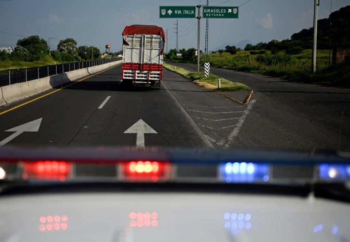 Police escort a truck carrying limes in Mexico's Michoacan state Police escort a truck carrying limes in Mexico's Michoacan state