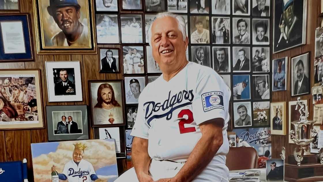 Los Angeles Dodgers manager Tommy Lasorda is pictured sitting on his desk in his office in Los Angeles