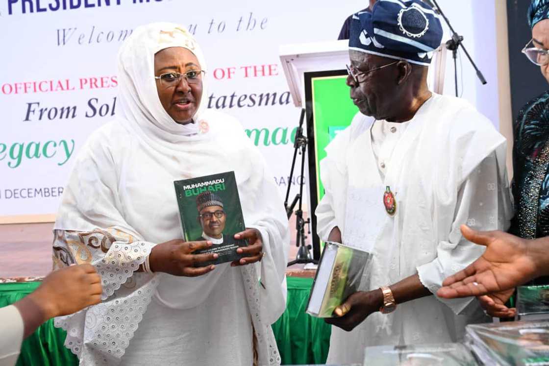President Bola Tinubu and Aisha Buhari at the ex-president Muhammadu Buhari's biography launch.