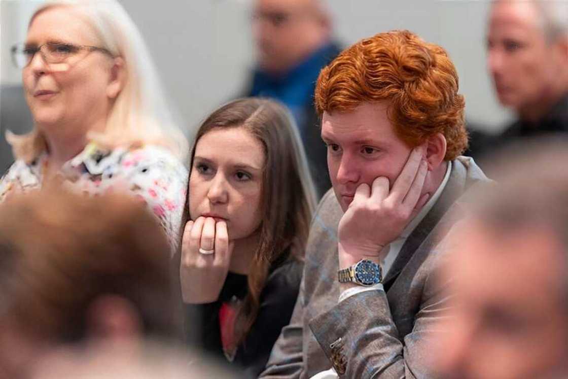 Buster Murdaugh and his girlfriend Brooklynn White listen to prosecutor John Meadors give his closing arguments in Alex Murdaugh's trial for murder at the Colleton County Courthouse.