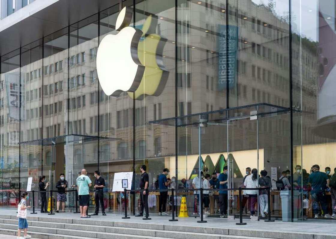 People enter an Apple store in Shanghai in June 2022 amid rising US calls to reduce reliance on China's giant economy People enter an Apple store in Shanghai in June 2022 amid rising US calls to reduce reliance on China's giant economy