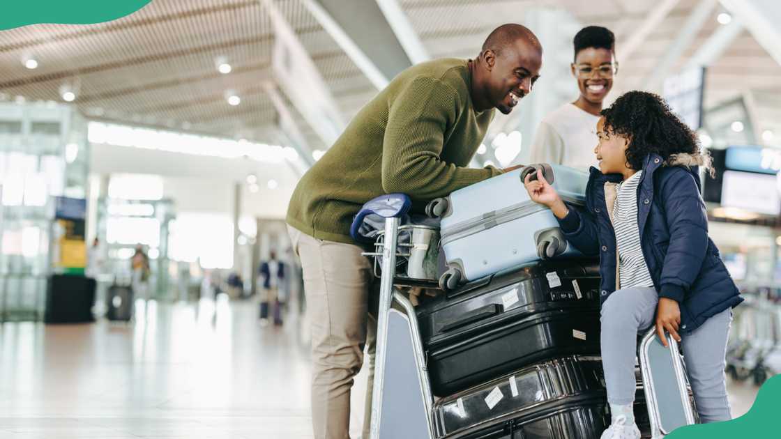 A family shares a happy moment at an airport