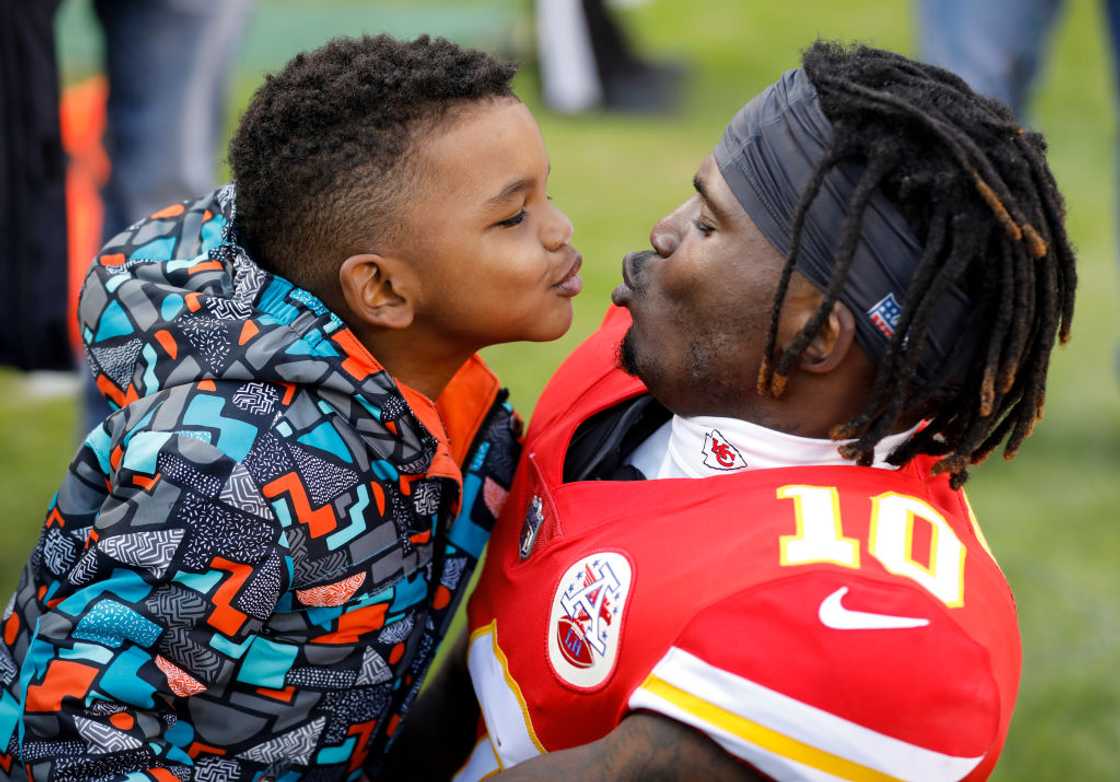 Tyreek Hill #10 of the Kansas City Chiefs teases his son, Zev prior to the game against the Oakland Raiders at Arrowhead Stadium Tyreek Hill #10 of the Kansas City Chiefs teases his son, Zev prior to the game against the Oakland Raiders at Arrowhead Stadium