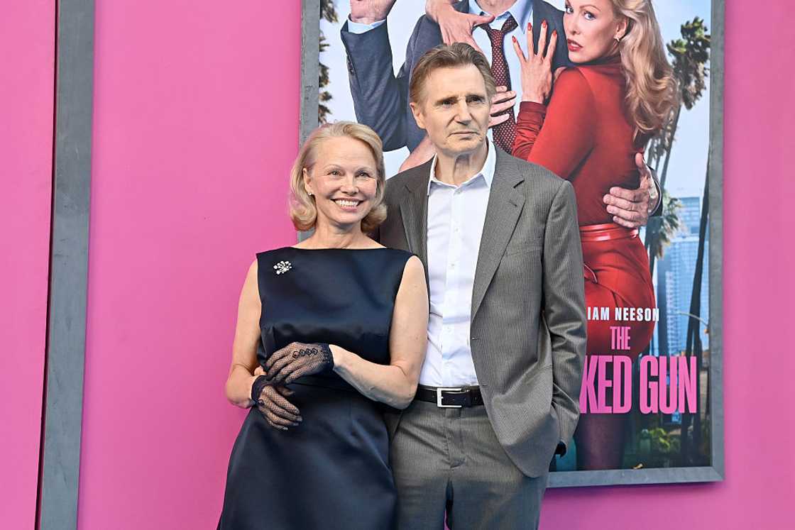 Pamela Anderson and Liam Neeson pose together at "The Naked Gun" US Premiere at the SVA Theatre Pamela Anderson and Liam Neeson pose together at "The Naked Gun" US Premiere at the SVA Theatre