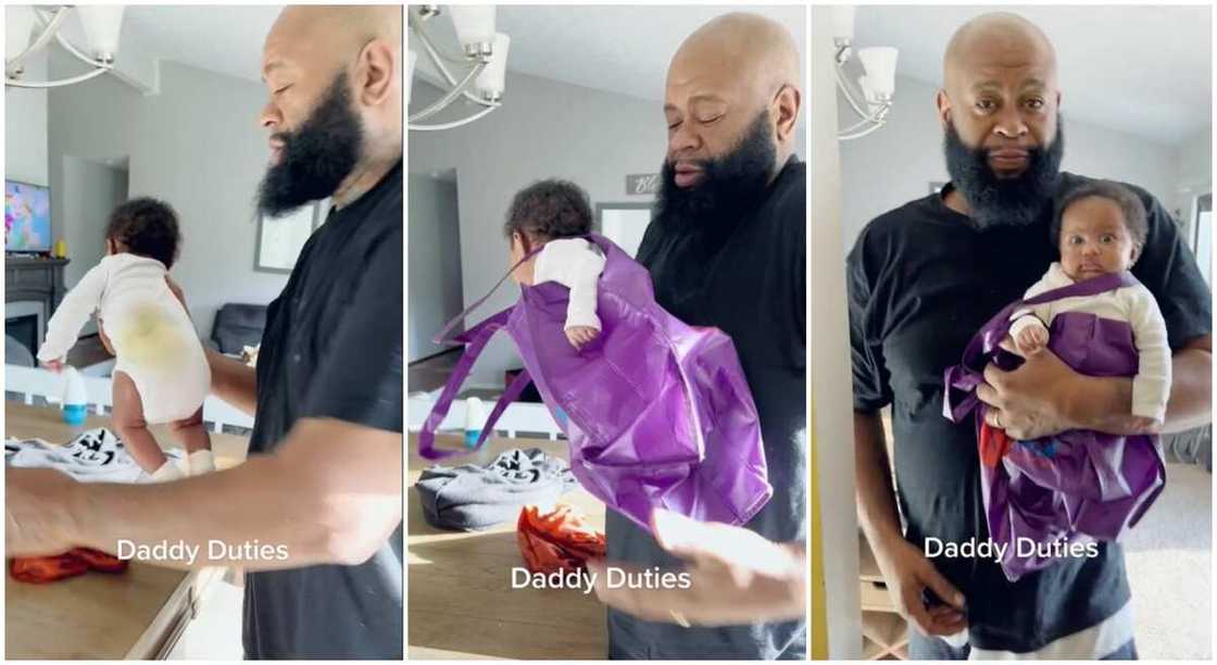 Man carrying a little child in a bag. Man carrying a little child in a bag.