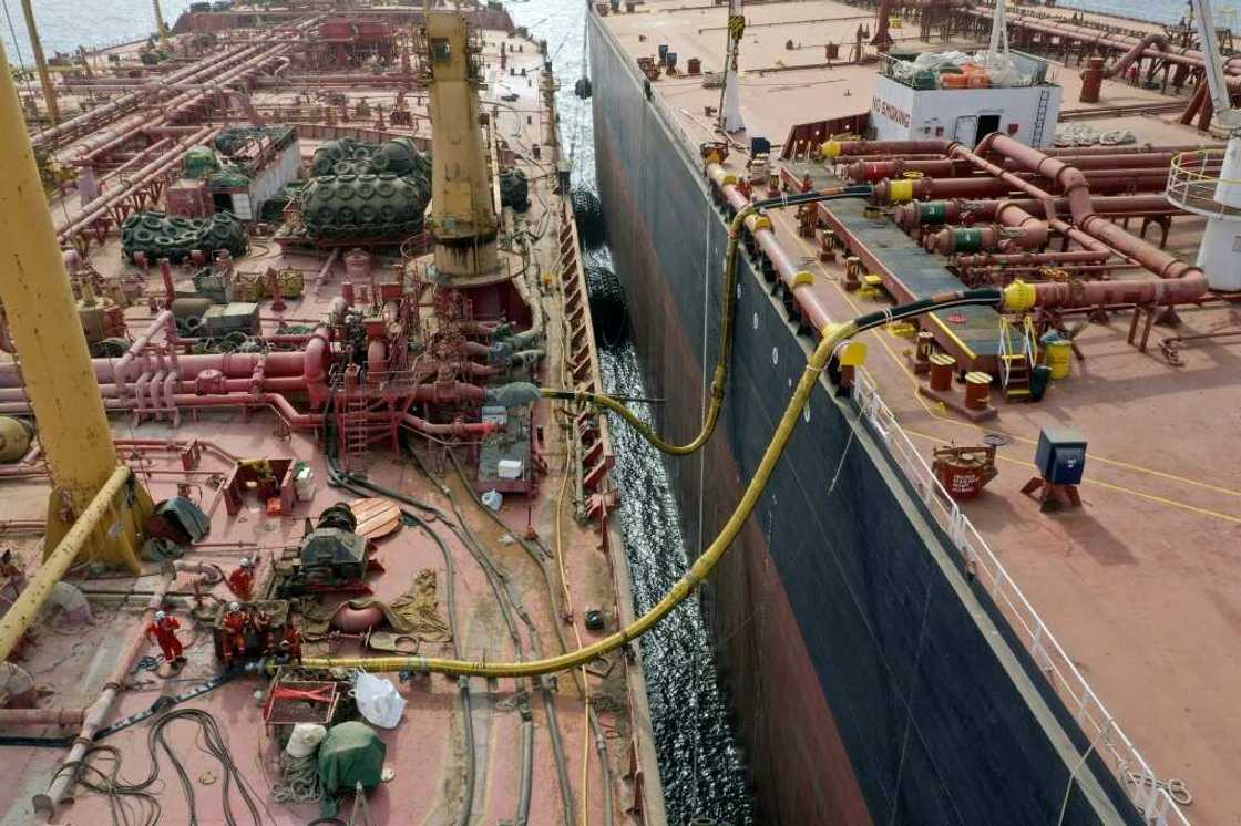 Workers prepare to transfer oil from the 47-year-old supertanker FSO Safer (L) to a UN-purchased replacement vessel in a bid to avert a catastrophic spill in the Red Sea off war-torn Yemen Workers prepare to transfer oil from the 47-year-old supertanker FSO Safer (L) to a UN-purchased replacement vessel in a bid to avert a catastrophic spill in the Red Sea off war-torn Yemen