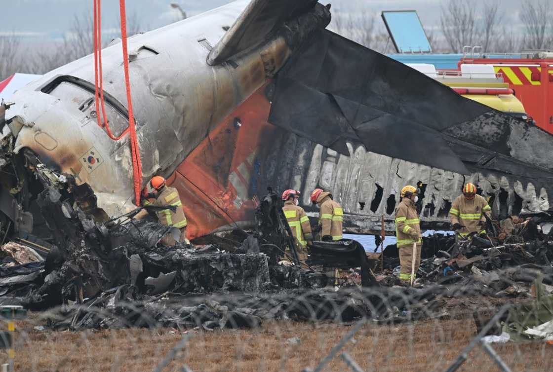 Firefighters and recovery teams work at the scene where a Jeju Air Boeing 737-800 aircraft crashed and burst into flames Firefighters and recovery teams work at the scene where a Jeju Air Boeing 737-800 aircraft crashed and burst into flames