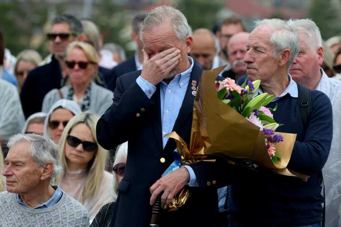 People attend a commemoration ceremony to mark the 20th anniversary of the Bali bombings at Sydney's Coogee Beach People attend a commemoration ceremony to mark the 20th anniversary of the Bali bombings at Sydney's Coogee Beach
