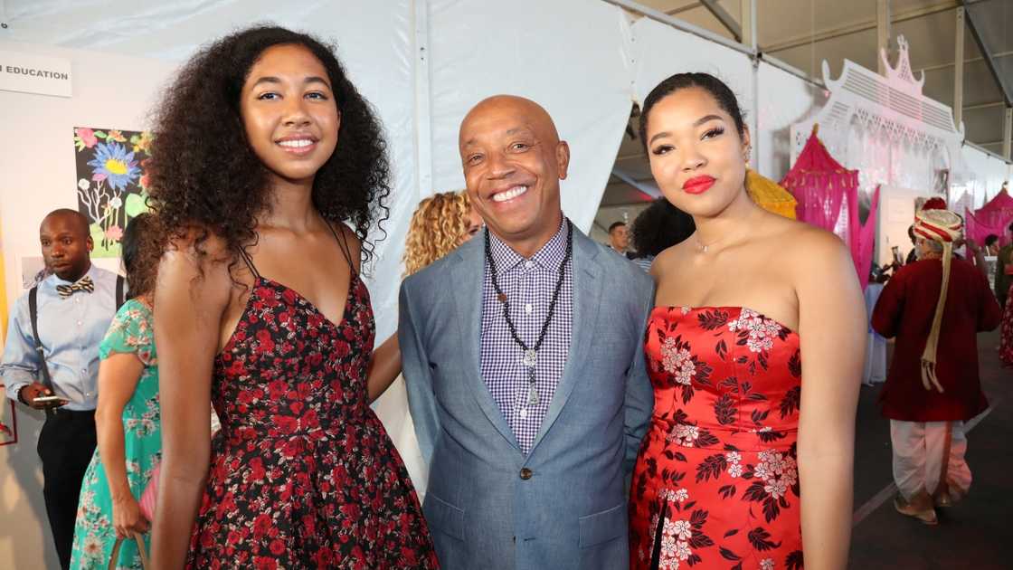 Russel Simmons (C) poses with his daughters Aoki and Ming Lee Simmons.