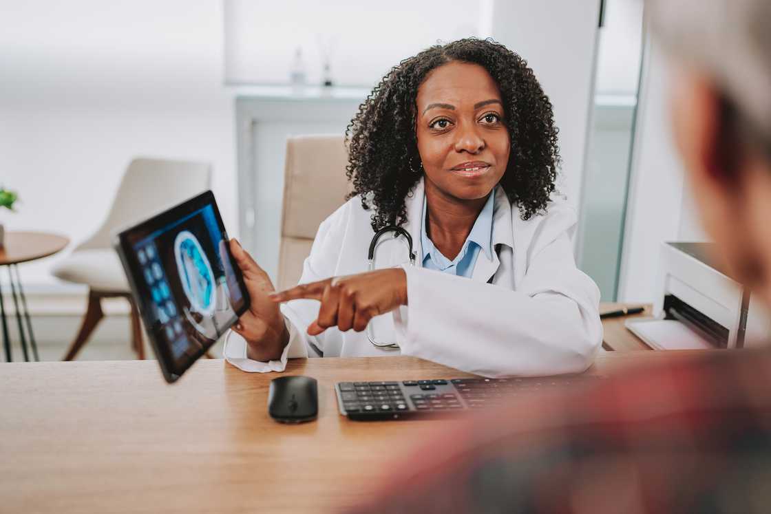 A female doctor with a patient in the office for a consultation.
