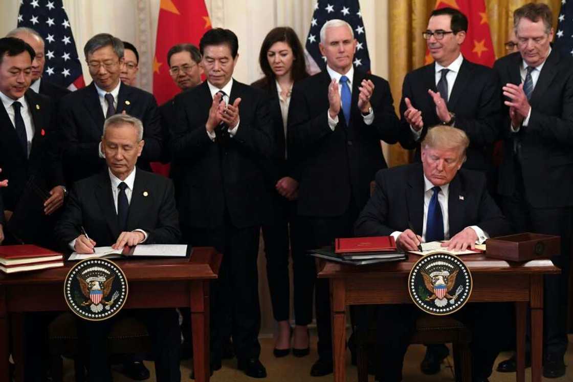 Then US president Donald Trump and China's Vice Premier Liu He sign a trade agreement between the US and China during a ceremony in the White House in January 2020 Then US president Donald Trump and China's Vice Premier Liu He sign a trade agreement between the US and China during a ceremony in the White House in January 2020