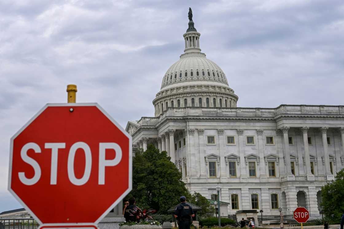 A stop sign is seen in front of the US Capitol -- where talks to repoen the federal government have seen little progress