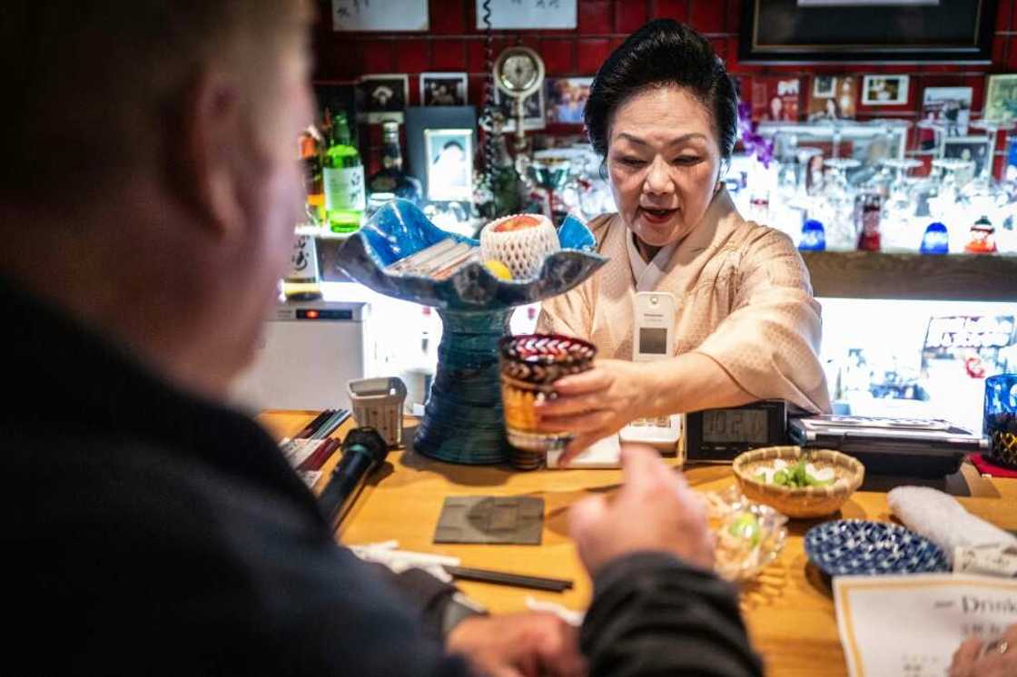 Japan's snack bars are cosy, retro establishments often crammed into small buildings and equipped with karaoke systems that echo late into the night