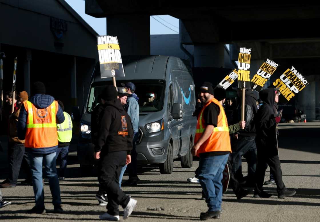 Amazon Teamsters union workers temporarily block an Amazon delivery truck in San Francsico as they picket outside an Amazon distribution center