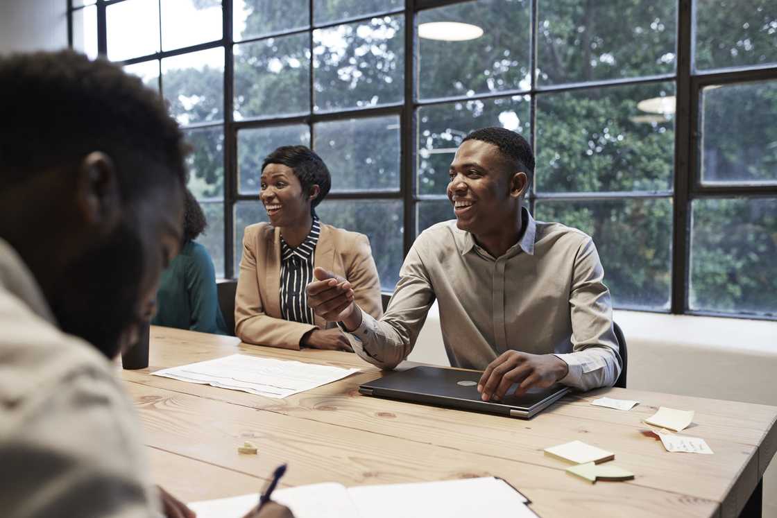 Business colleagues sitting in conference room during office meeting