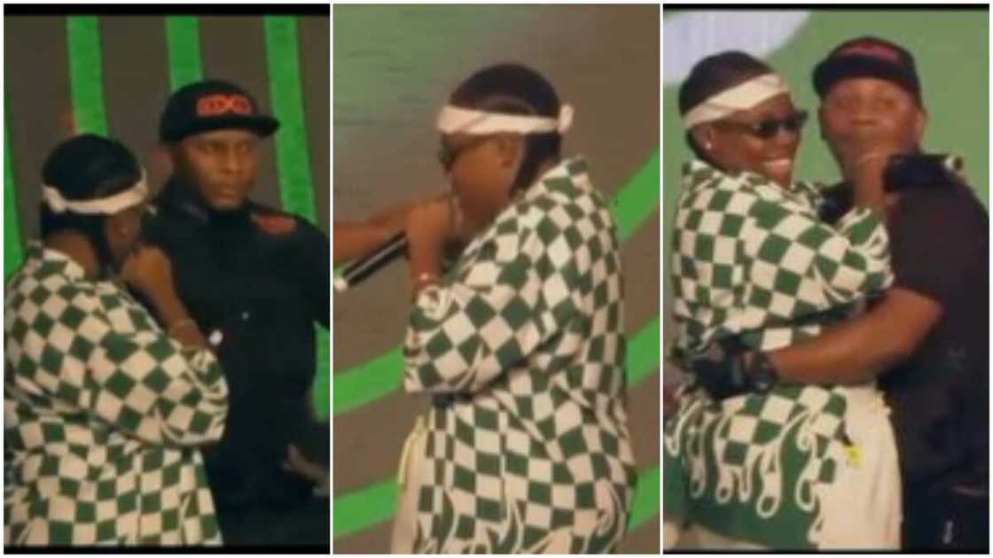 Teni and her cameraman/Teni asks him to hold her waist.