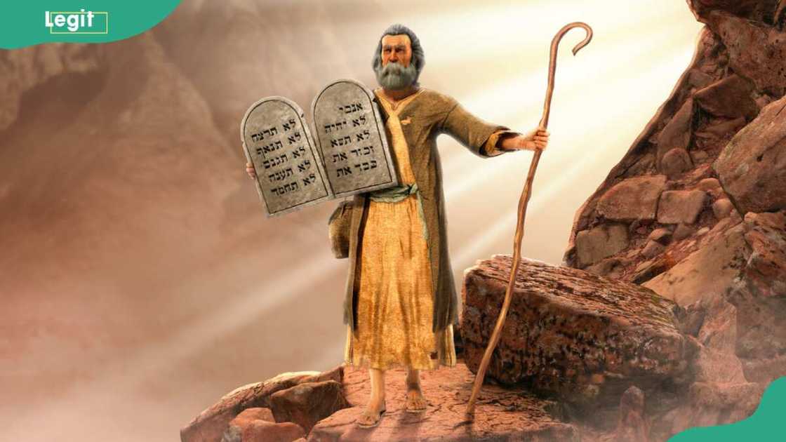 Moses holding 10 Commandments tablets coming down Mount Sinai