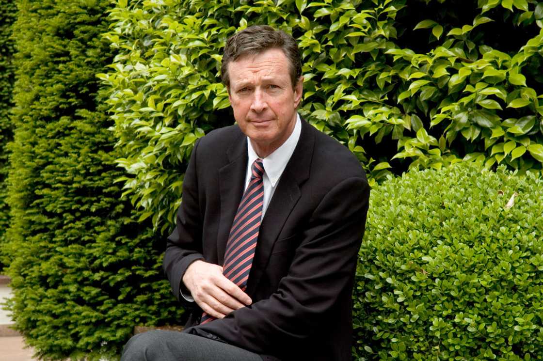 Michael Crichton poses in September 2005