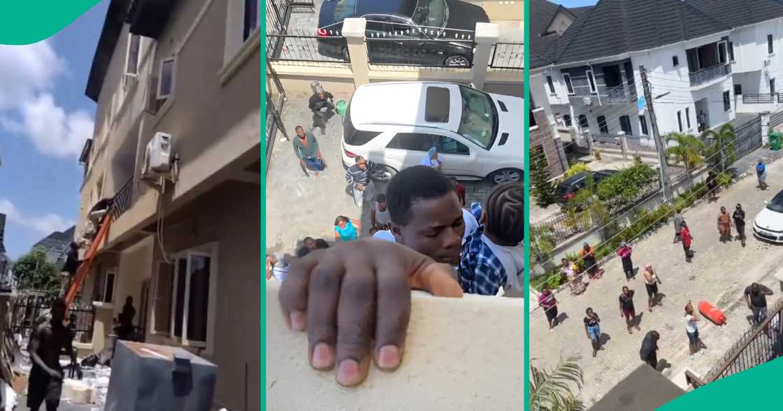 Moment man holds on to baby while hanging from balcony of building on fire Moment man holds on to baby while hanging from balcony of building on fire