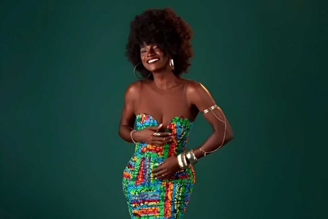 Abi poses in a traditional Nigerian dress for a photoshoot.