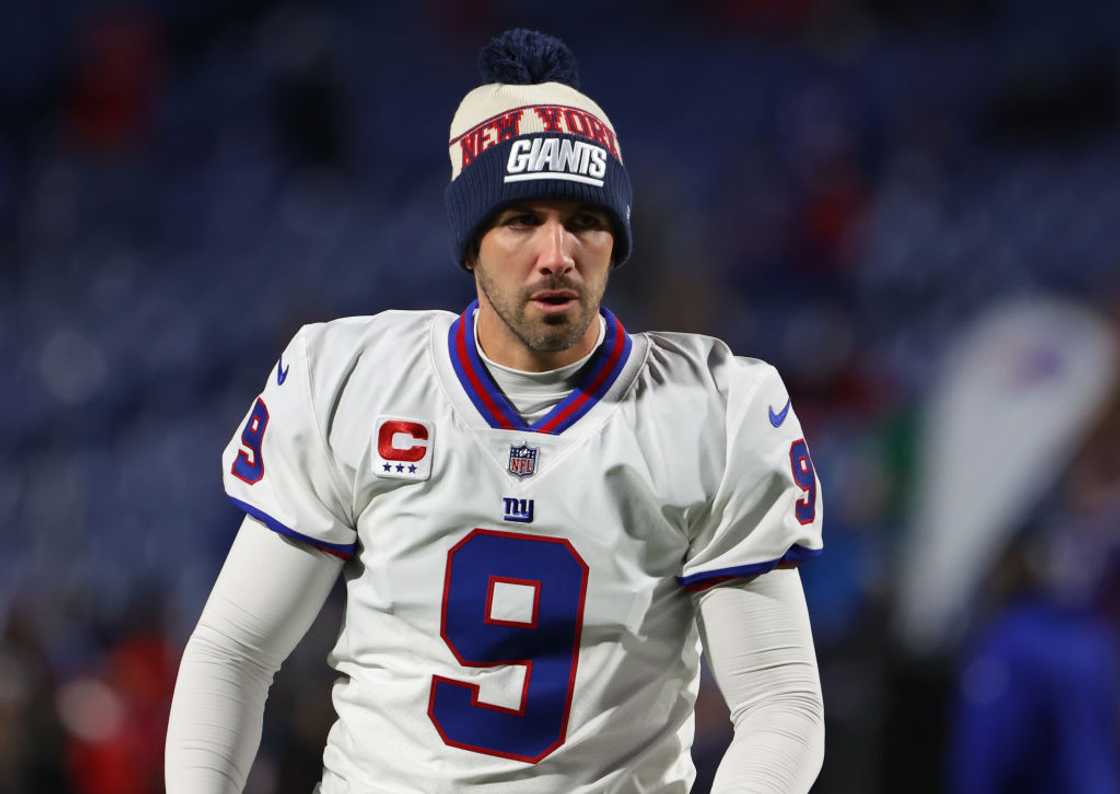 Graham Gano walks on the field before a game starts