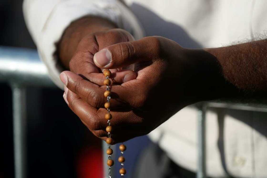 Catholic faithful await Pope Francis at the shrine of Sainte-Anne-de-Beaupre in Quebec, Canada, on July 28, 2022 Catholic faithful await Pope Francis at the shrine of Sainte-Anne-de-Beaupre in Quebec, Canada, on July 28, 2022